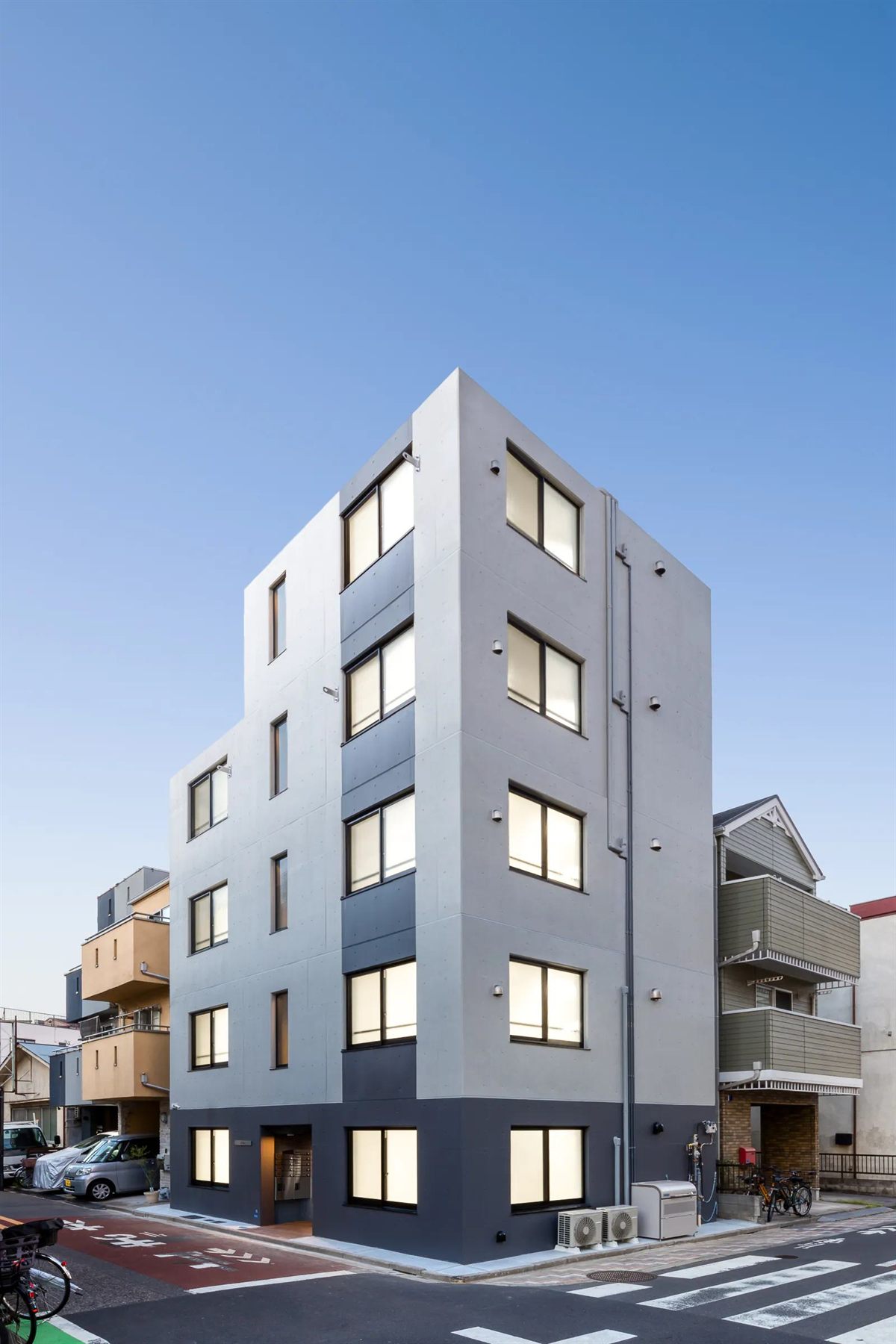 TS Series reinforced-concrete condominium, a five-story building with white walls