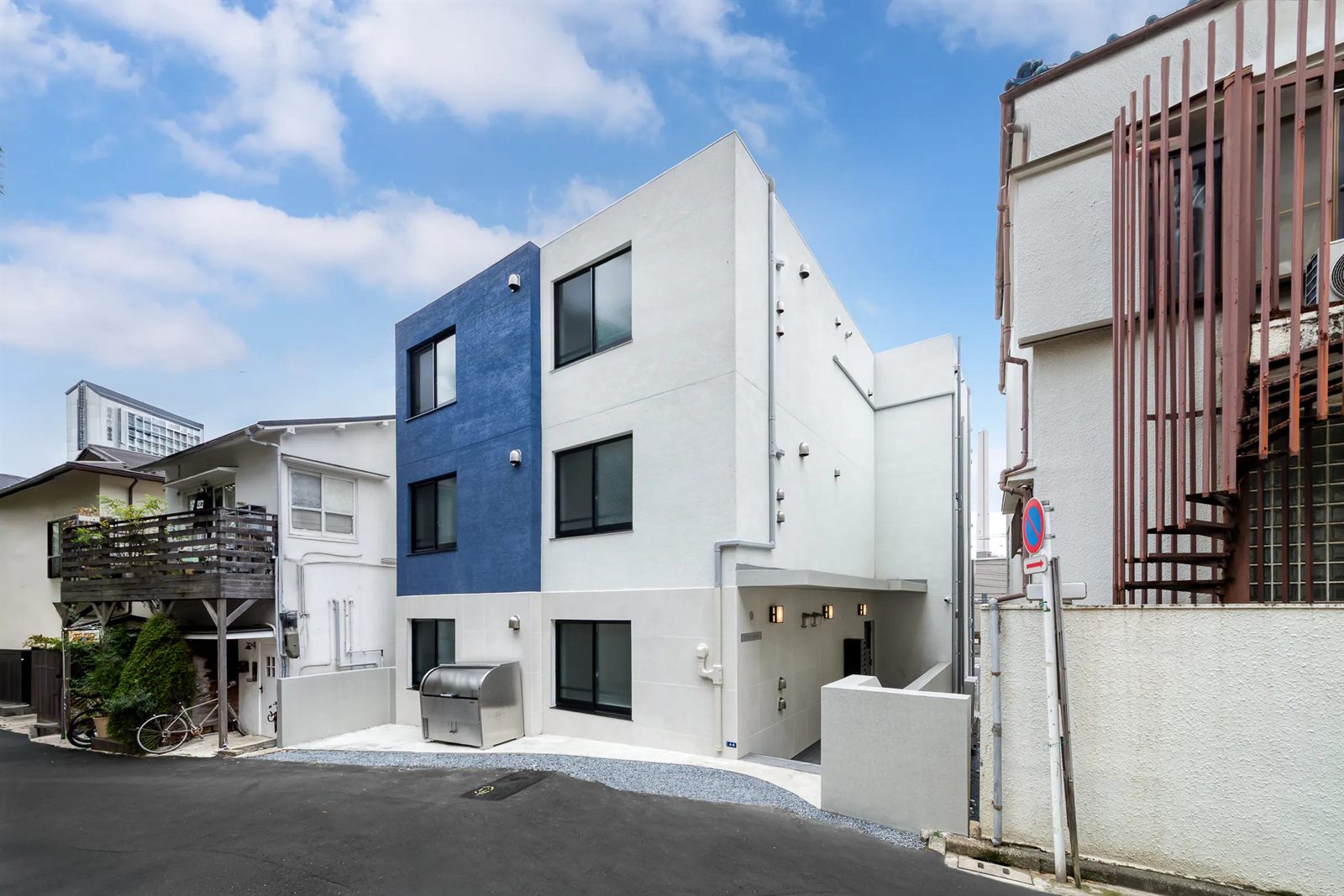 TS Series reinforced-concrete condominium with white walls and a blue accent